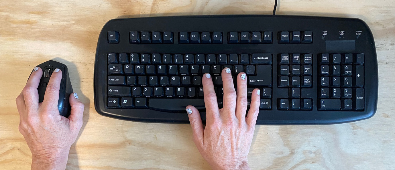 Figure 7.8 – A dominant left hand on the mouse and a right hand on the right side of the keyboard
