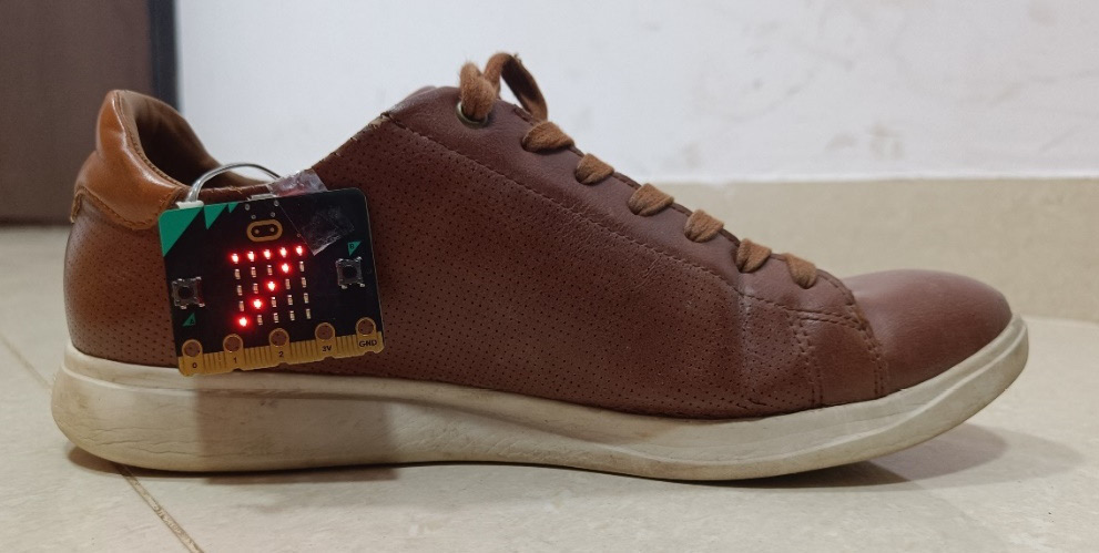 Figure 15.1 – A Micro:bit mounted on a shoe to count the number of steps the user takes
