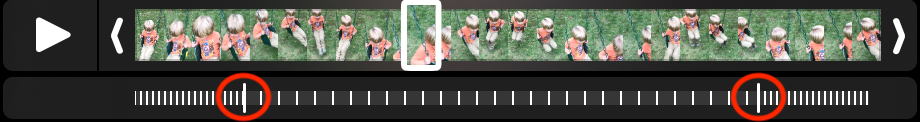 Figure 101: Adjust the handles (circled in red) to change the placement of the slow-motion effect in the video. The slow-motion portion is denoted by the widely spaced white lines.